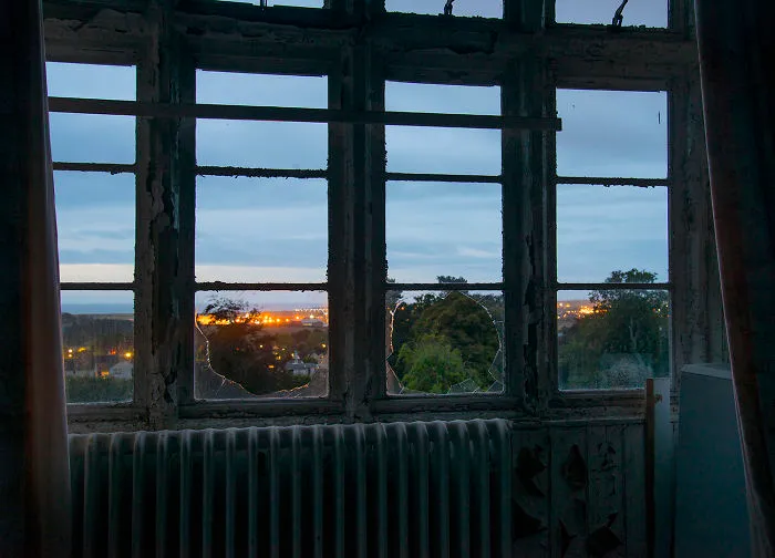 The Lights Of The City In The Distance At Dawn