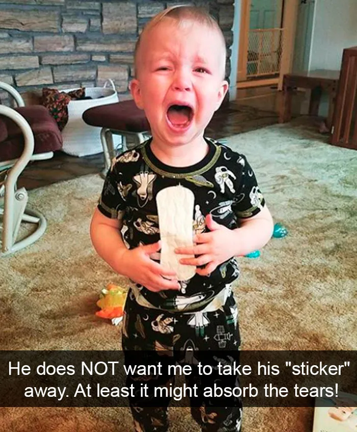 He Does Not Want Me To Take His "Sticker" Away. At Least It Might Absorb The Tears!