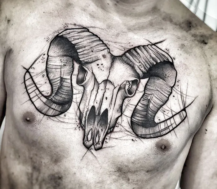 "Intricate chest tattoo of a ram skull with detailed line work, showcasing incredible tattoo art."