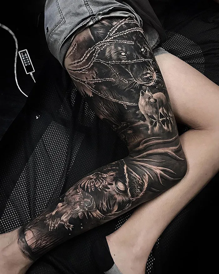 Wolves and Owls in a Black Forest Leg Tattoo
