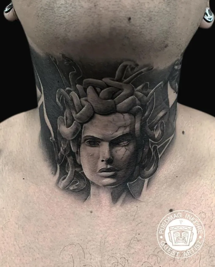 Medusa-inspired neck tattoo with intricate details showcasing creative ink work.