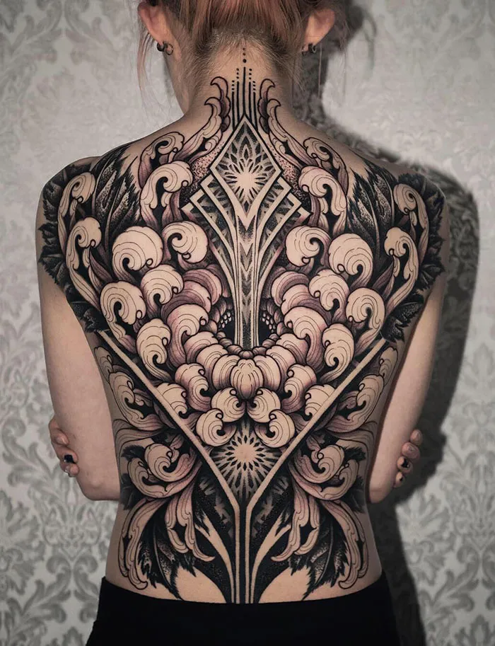 Ornate back tattoo masterpiece showcasing intricate patterns and detailed artistry.