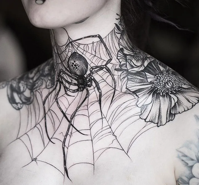 Creative neck tattoo featuring a detailed spider and web design.