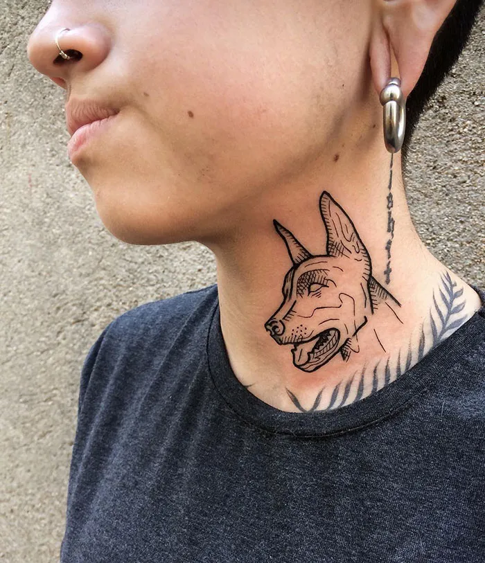 Creative neck tattoo featuring a detailed dog design with geometric elements.