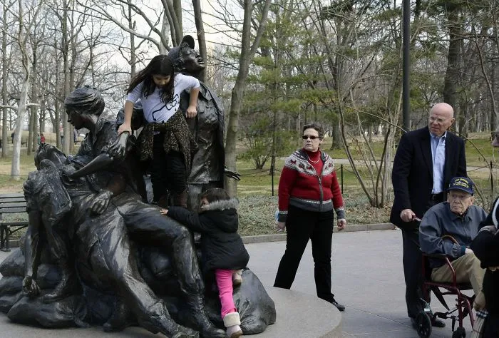 Parents Letting Their Children Play On The "Vietnam Women's Memorial" Right In Front Of Veterans