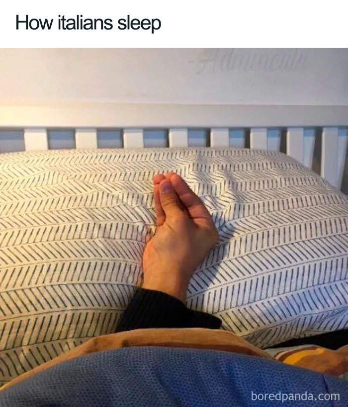 Hand making a typical Italian gesture while lying in bed, a humorous sleeping meme from the funniest sleeping memes collection.