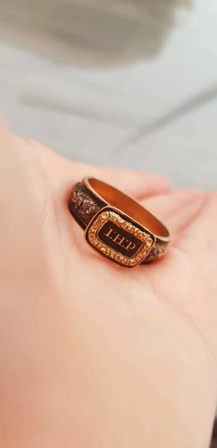 I Found This Ring In My Backyard While Doing Gardening. After Cleaning It, It Doesn't Look Like A Normal Ring. Any Ideas ?