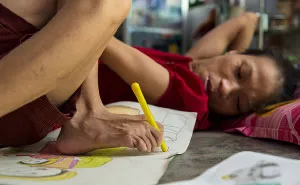 This 27-Year-Old Girl Is Disabled But She Uses Her Feet To Draw Optimistic Pictures With Hopes Of Supporting Her Mother