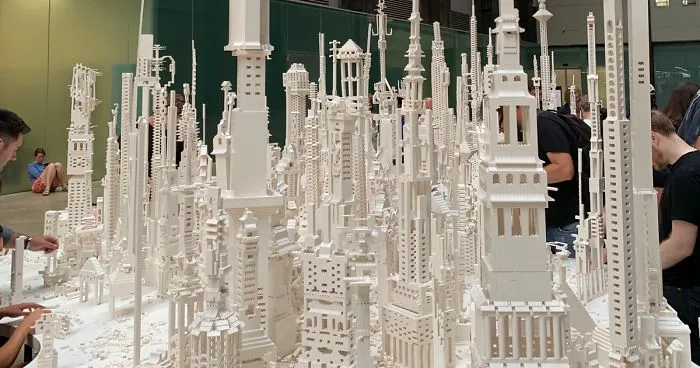 A City Is Being Built With White Lego Pieces And Everyone Can Join The Process