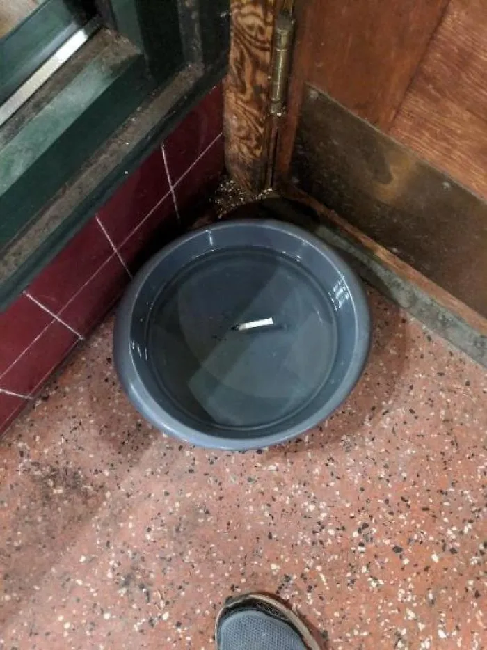 Someone Put Out Their Cigarette In A Dog Dish Outside This Local Shop.