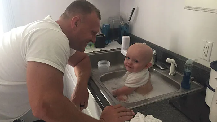 Police Officer Pulled Over A Drunk Woman Whose Baby Was Covered In Feces And Vomit In The Back Seat. The Baby Was Screaming, So The Officer Bathed Him In The Barrack's Sink