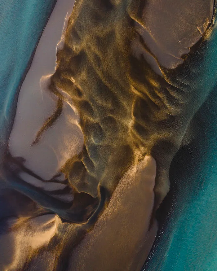Drone Photo Of Sulfur River Merging With Fresh Water Coming Down From A Melting Glacier