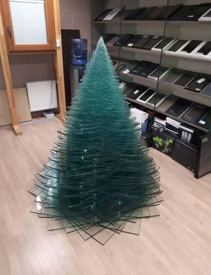 Tech Store Employees Make A Christmas Tree Out Of Sheets Of Glass