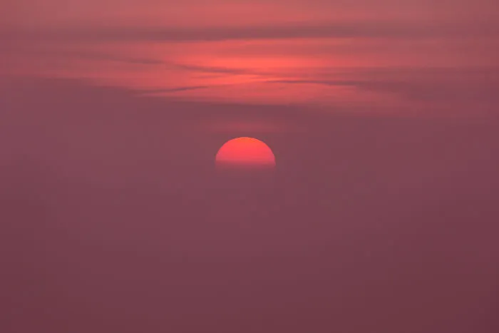 Sun Sets In The Mist