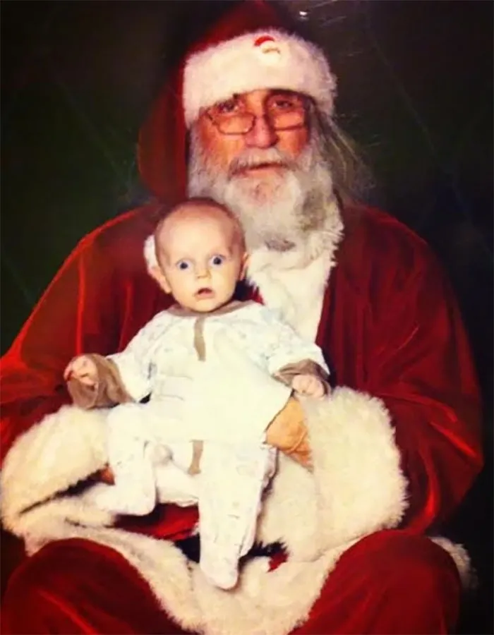My 3 Month Old Son With A Look Of Shock Only He Could Pull Off At Being Sat On Santa’s Lap