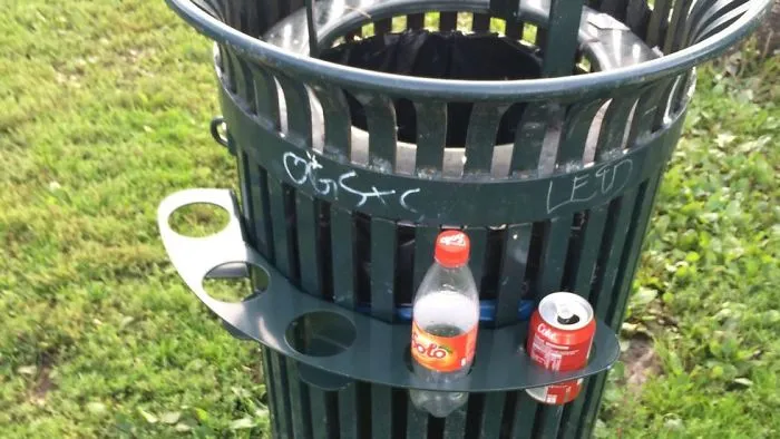 In Norway, You Get A Small Amount Of Money For Recycling Bottles/Cans. A Lot Of Our Trash Cans Have These Holders So Poor And Homeless People Don't Have To Search Through The Trash To Collect Them