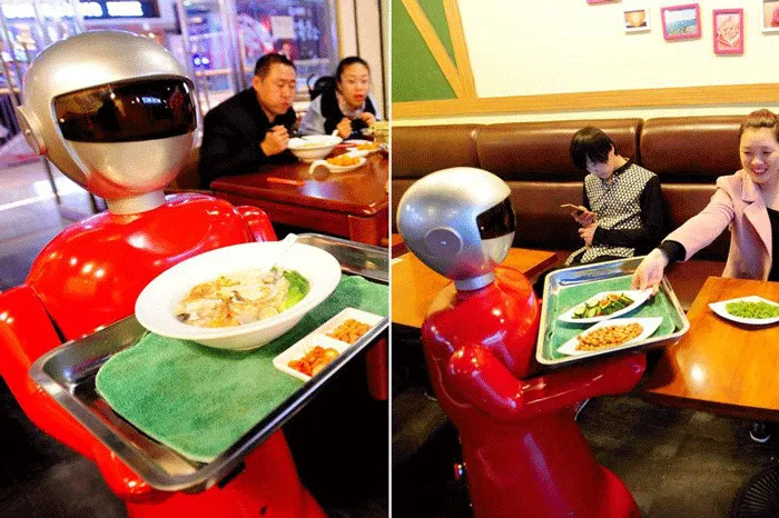 Robot Waiter Serves In Chinese Restaurant