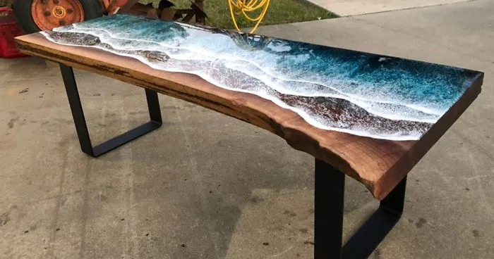 These Artists Create Mesmerizing Tables That Look Like They're Being Washed By An Ocean Wave