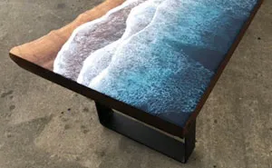 These Artists Create Mesmerizing Tables That Look Like They're Being Washed By An Ocean Wave