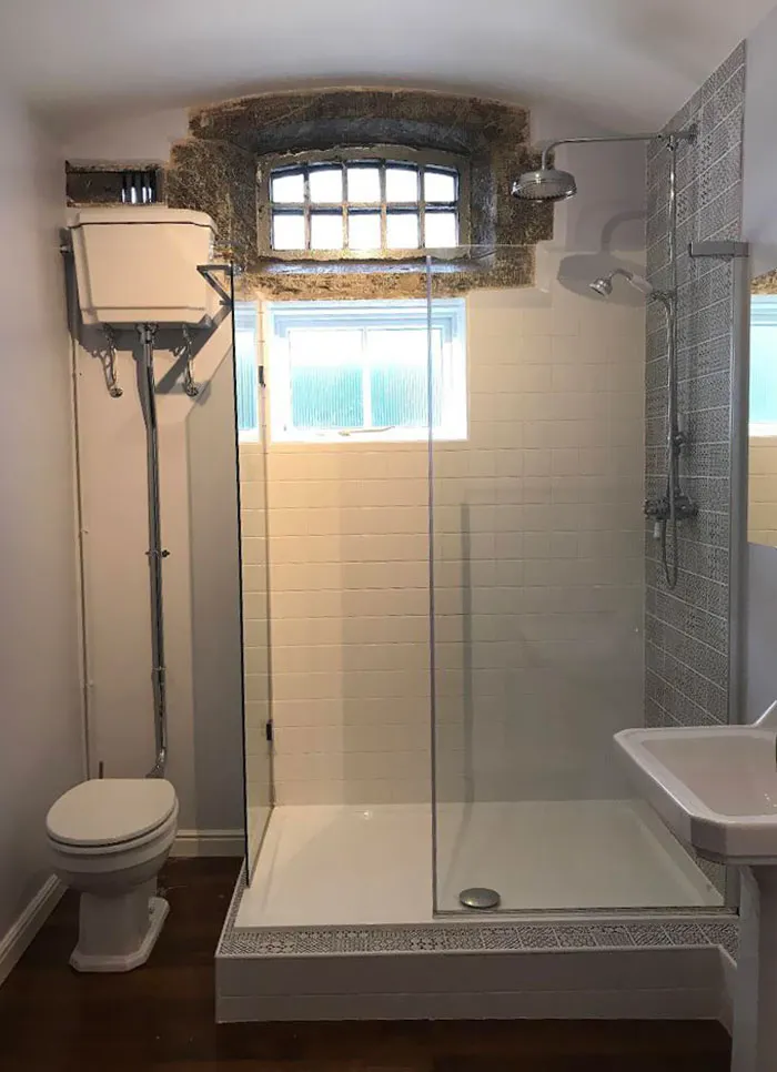 My House Used To Be A Police Station And My Bathroom Is An Old Jail Cell, The Original Window Is Still In Place