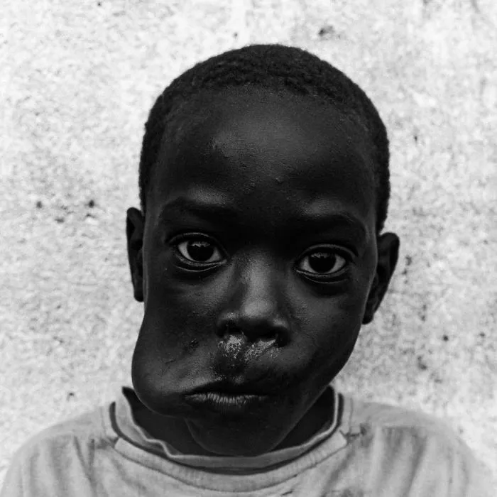 "Boy Eating Mango - São Tomé 2018" By Theo Gould, UK (2nd Place In The Portrait Category)
