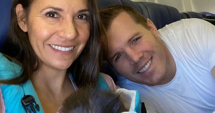 Couple Flies Home With Newly Adopted Baby And Passengers Decide To Throw Them An Impromptu Baby Shower