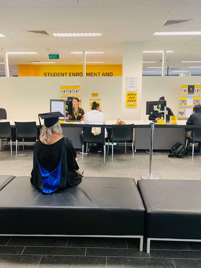 Girlfriend's Grad Cancelled, So She’s Picking Up Her Degree From The Student Desk