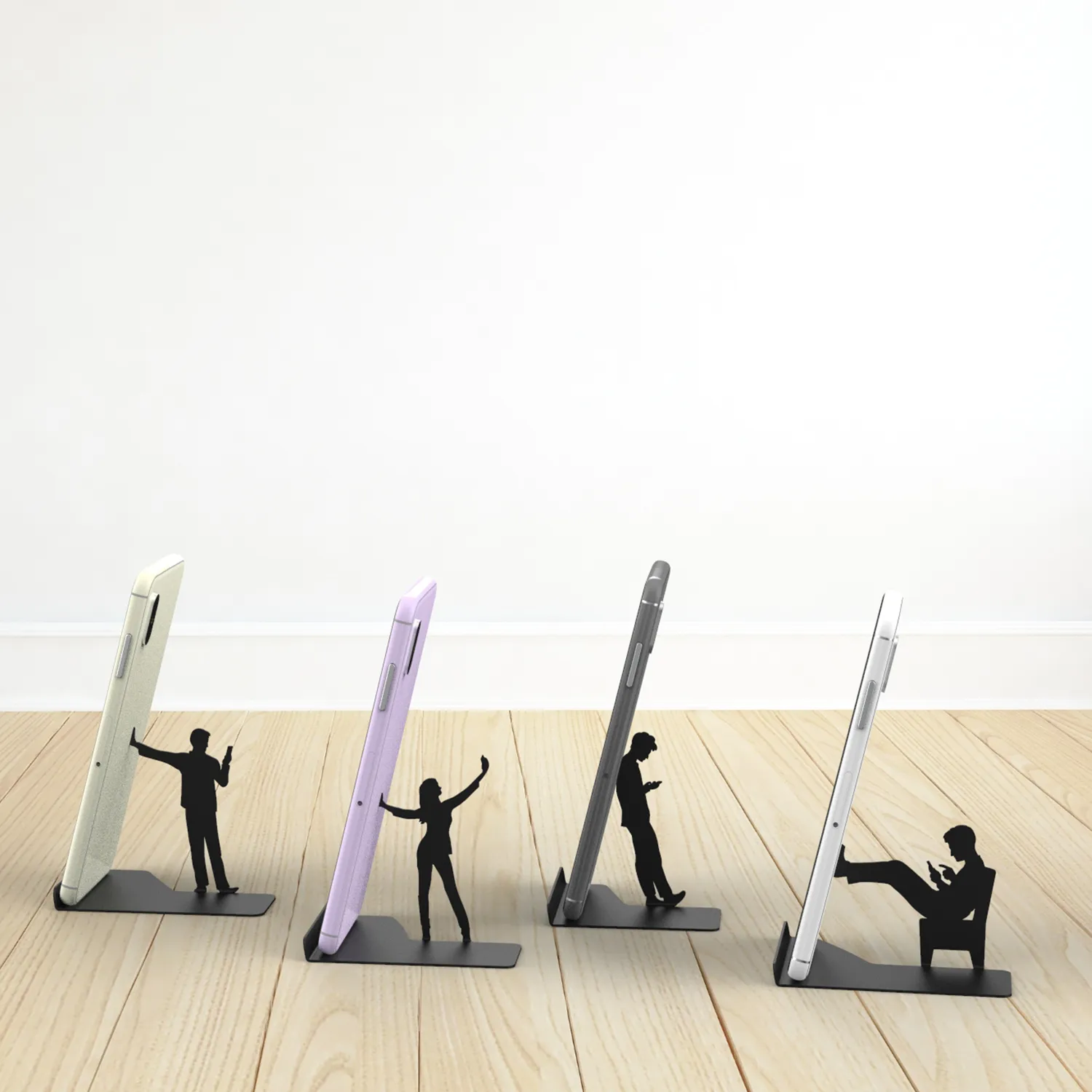 I Designed A Humorous Cell Phone Stand With Human Figures Holding Your Phone, But In Fact They’re Mostly Busy With Their Own Cell Phone!