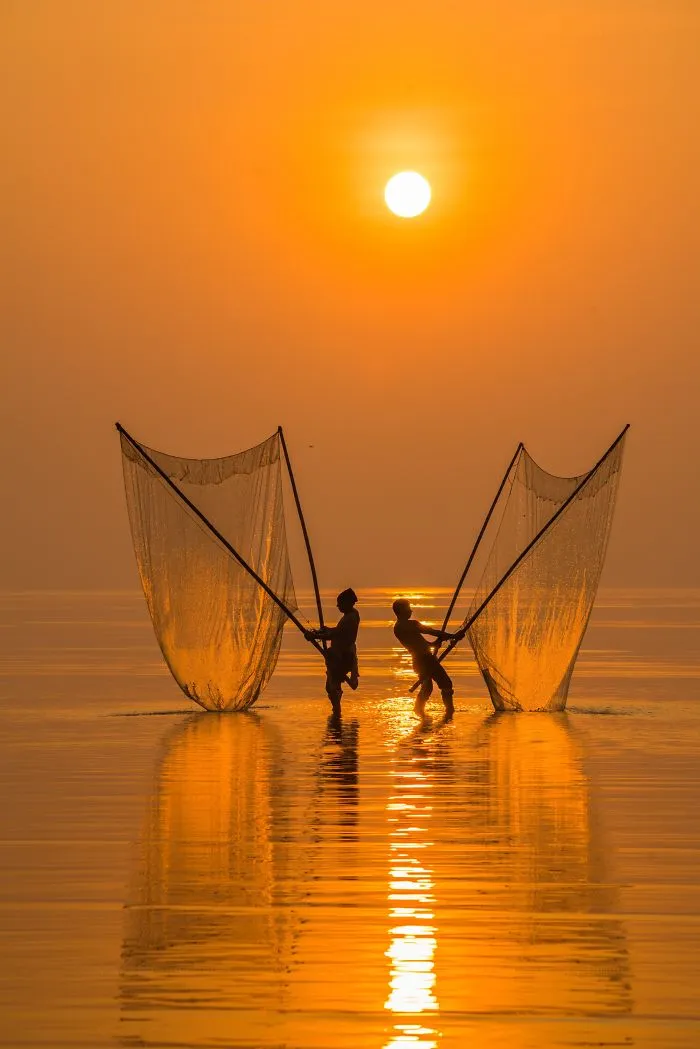 Fisherman Under The Dawn