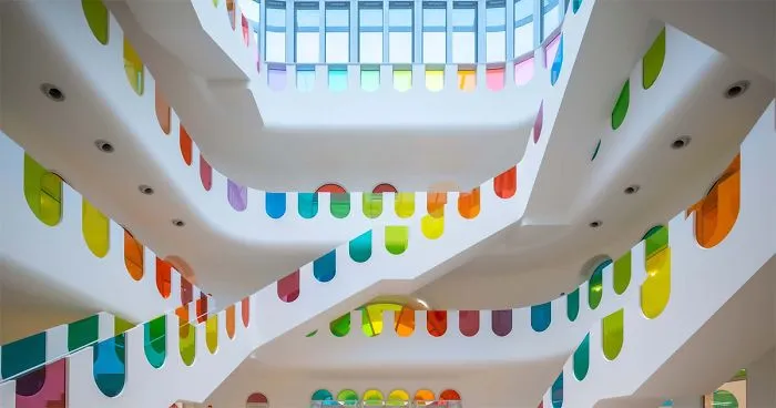 483 Rainbow-Colored Glass Panels Emit A Rotating Kaleidoscope In This Playful Kindergarten