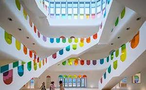 483 Rainbow-Colored Glass Panels Emit A Rotating Kaleidoscope In This Playful Kindergarten