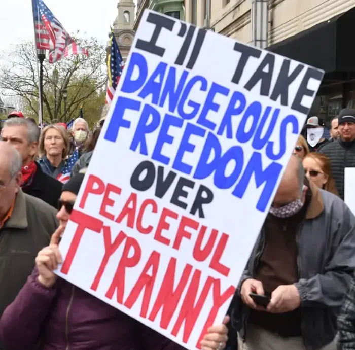 16 Not The Brightest People Who Are Against The Quarantine Holding Some 'Interesting' Signs