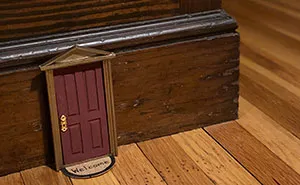 Woman Puts Dollhouse Doors As Electrical Outlet Covers Around Her Home