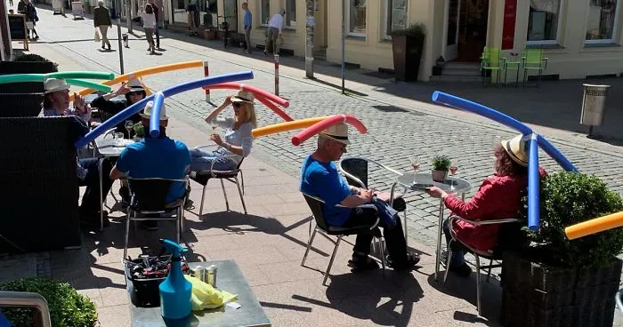 Cafe In Germany Gives Customers Hats With Pool Noodles To Keep Them Apart