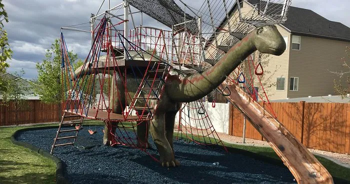 This Dad Should Win An Award For Building An Incredible 14-Meter Dinosaur Jungle Gym For His Kids