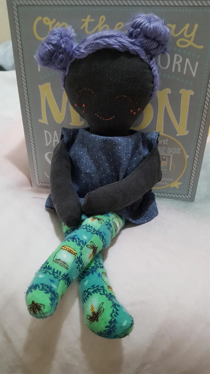 Zero waste quarantine project: I made a baby doll for my daughter out of clothing scraps, remnants, and thrifted yarn. Stuffing is an old cotton apron I shredded