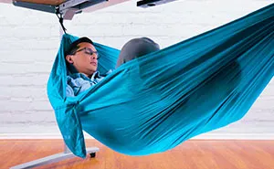 This $55 Under-Desk Hammock Lets Employees Take The Most Chill Breaks At Work