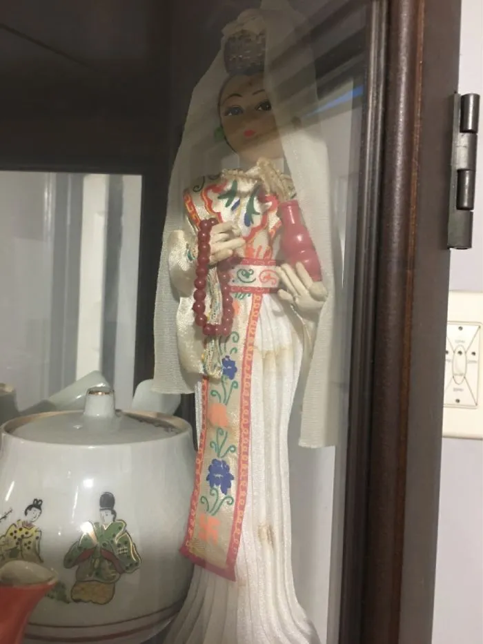Doll Got By Dad. Last Symbol On Her Sash In Orange Is Swashtika But In A Religion Not Nazi