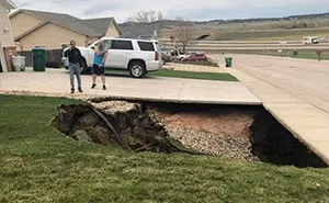 Giant Sinkhole Opens Up In South Dakota, People Go Inside It To Investigate And The Pics Go Viral