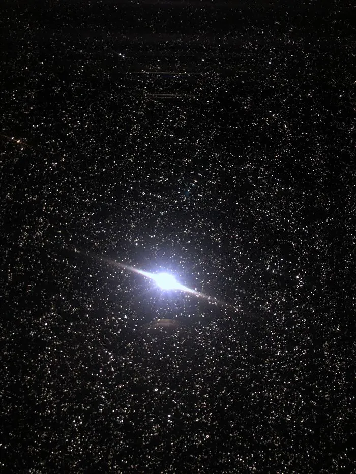 I Took A Picture Of A Window With Rain On It And It Looks Like A Planet Surrounded By Millions Of Stars