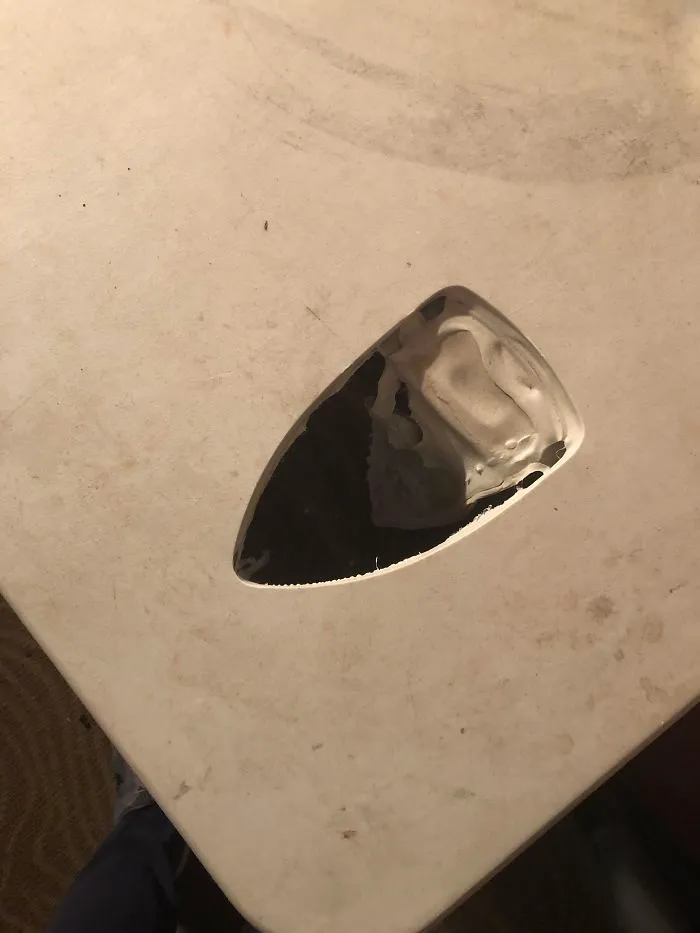 An Iron Melted Through This Plastic Table