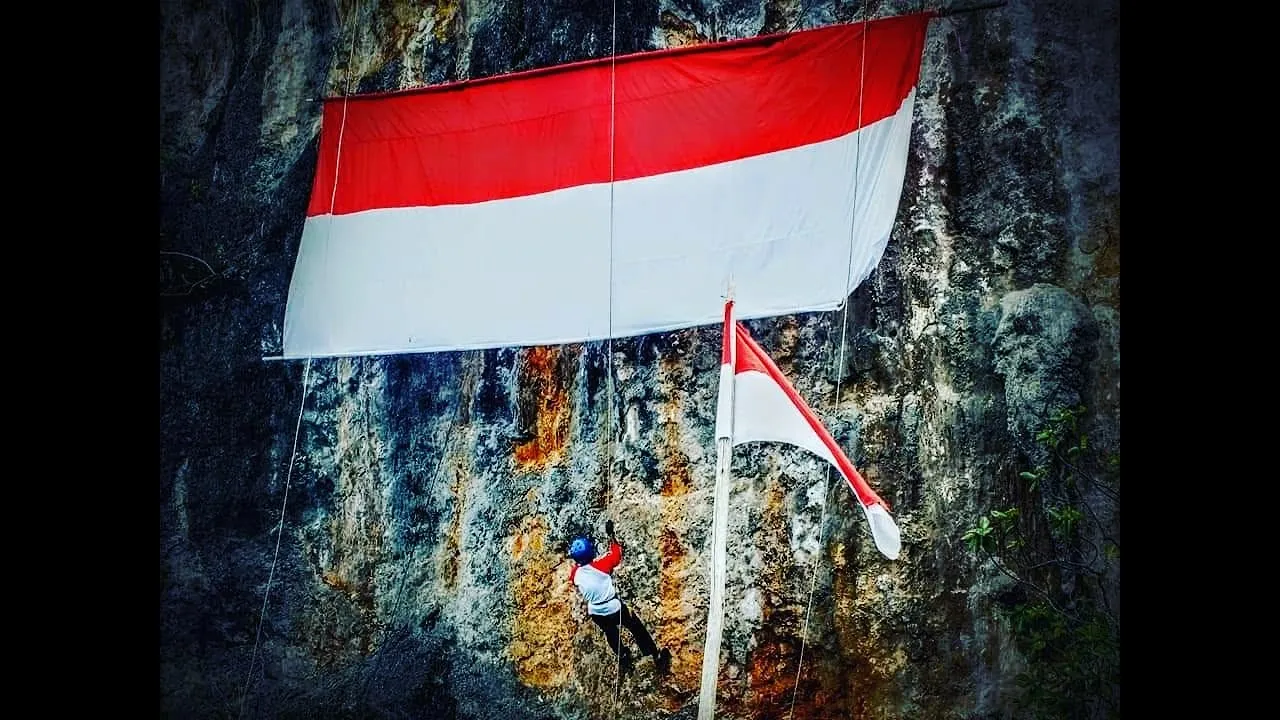 My Brother Climb Down A Cliff In Fakfak To Display Indonesian Flag