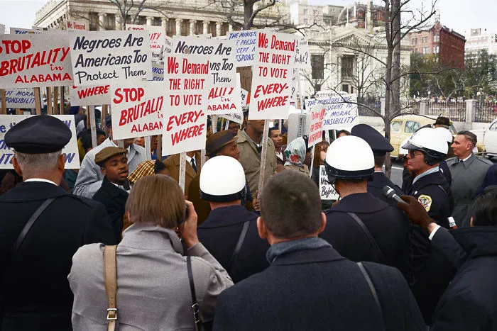 African American Demonstrators Outside The White House, With Signs "We Demand The Right To Vote, Everywhere" And Signs Protesting Police Brutality Against Civil Rights Demonstrators In Selma, Alabama