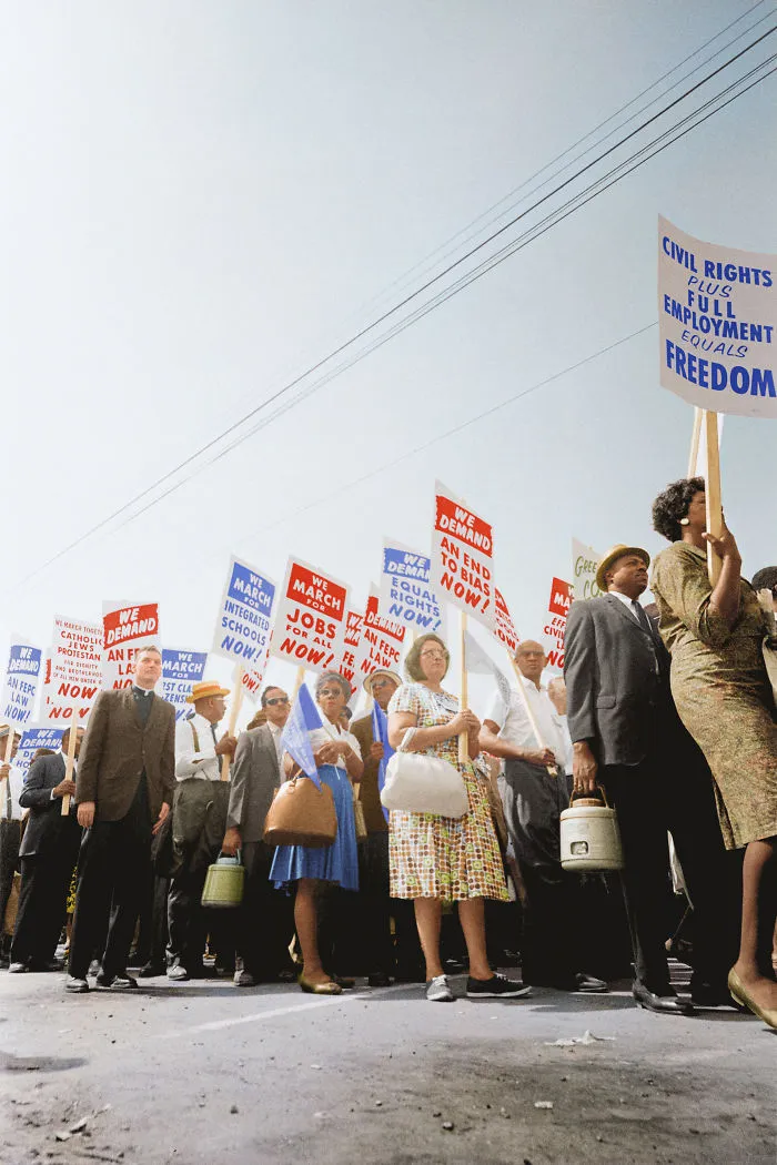 Demonstrators Marching In The Street Holding Signs During The March On Washington