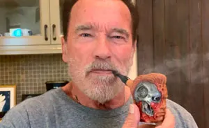 Someone Says This Signed Photo Of Arnold Smoking A Fan-Gifted Pipe Is Fake, Gets Shut Down By Arnold Himself