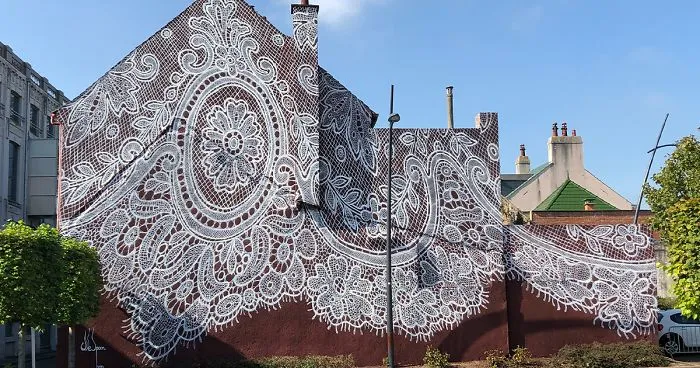 Warsaw-Based Artist Spray-Paints A Beautiful Lace Mural On The Side Of A French Lace Museum