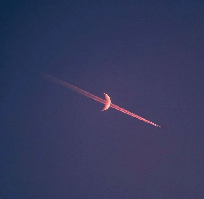 This Photo Of The Moon And A Plane