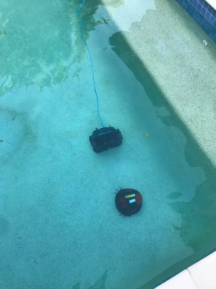 This Is What Happens When Your Wife Leaves The Door Open To The Pool Area. Your Expensive Robot Vacuum Decides It Wants To Meet The Pool Vacuum... Goddammit