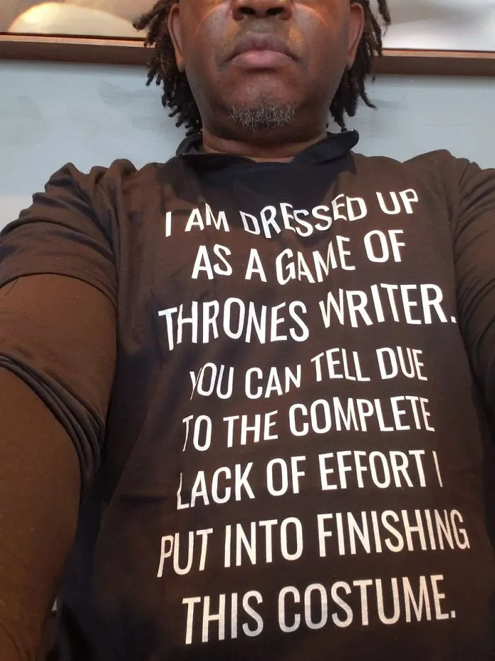A man wearing a witty text t-shirt as a lazy option for low-effort DIY Halloween costumes.