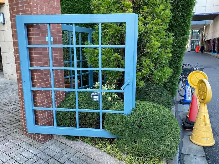 This Gate Has Been Open For So Long That A Bush Has Grown Around It